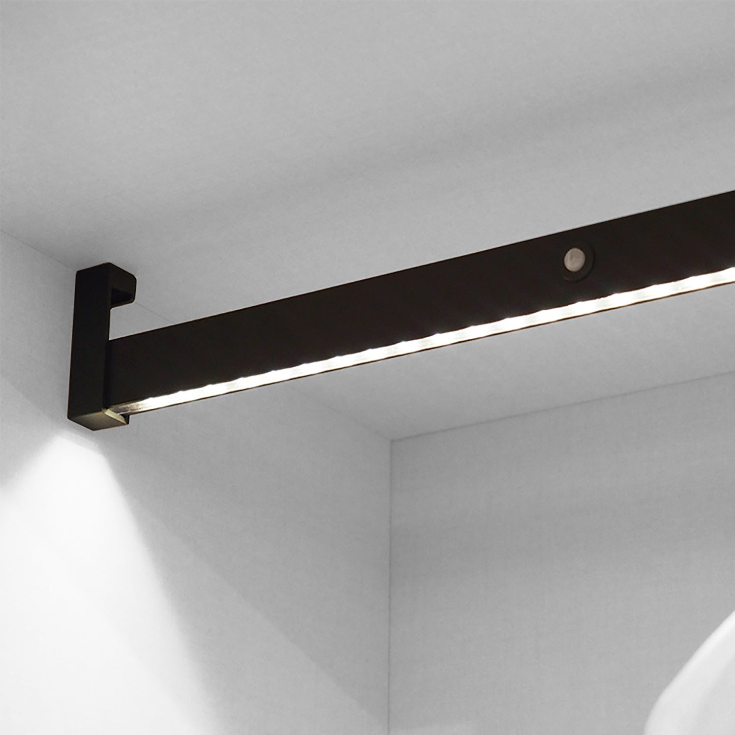 Castor LED closet rail with light, removable battery and motion sensor, painted mocha/anodized